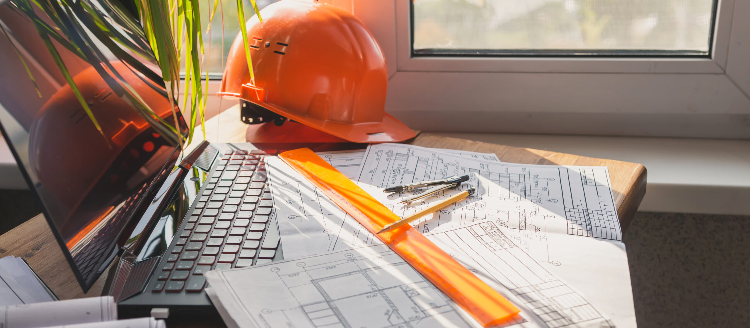 architect design working drawing sketch plans blueprints and making architectural construction model in home.