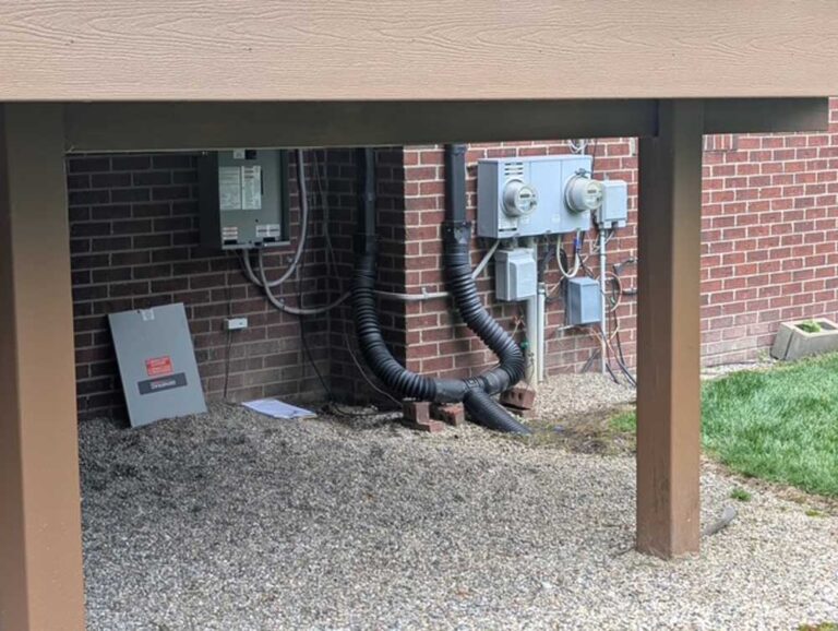 house electrical boxes outside and under a porch