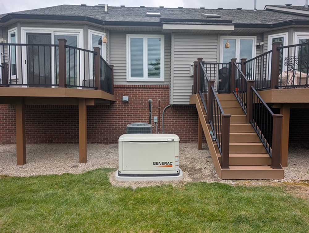 generac generator beside a home installed by Budget Electric & Generators