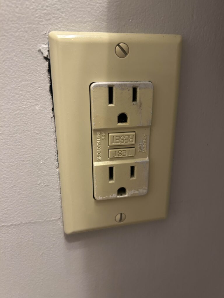 A GCFI outlet in a basement bathroom